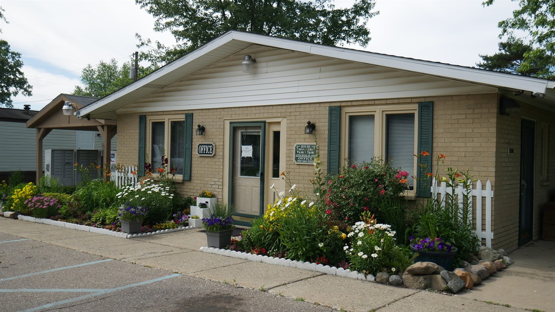 Lapeer Meadows office garden and front entrance