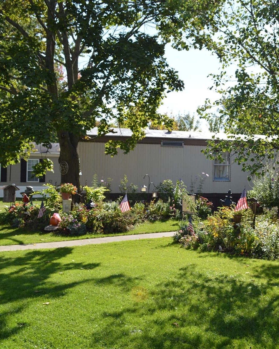 Large wooded lawn and landscaping at Lapeer Meadows
